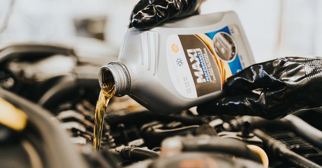 Close-up of a mechanic pouring engine oil into a car engine, highlighting maintenance work.