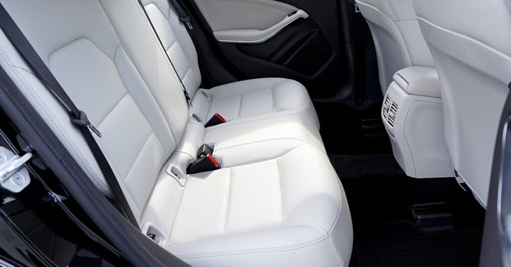 Explore the modern and luxurious feel of a car's interior with pristine white leather seats.