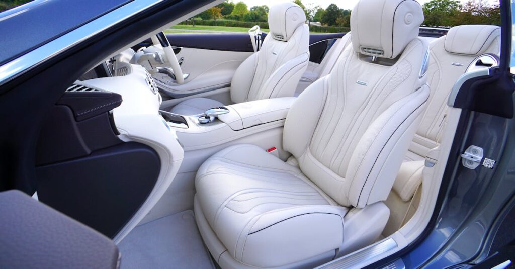 Explore the elegance of a luxury car interior with pristine white leather seats and advanced design features.