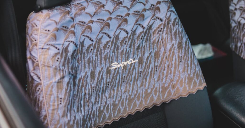 Interior shot of a car featuring a luxurious and decorative seat cover with 'Supra' inscription.