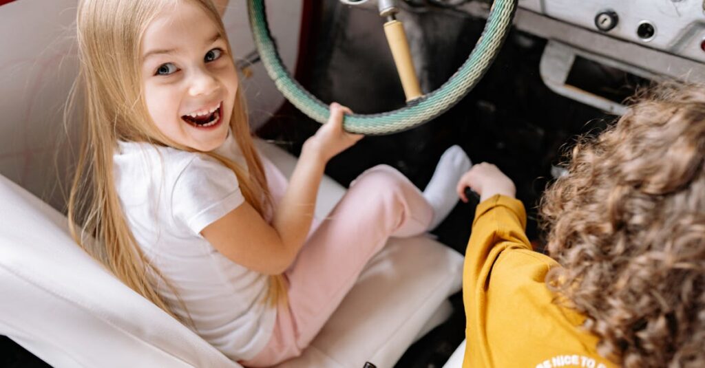 Children enjoying playtime by pretending to drive a vintage car, full of laughter and excitement.